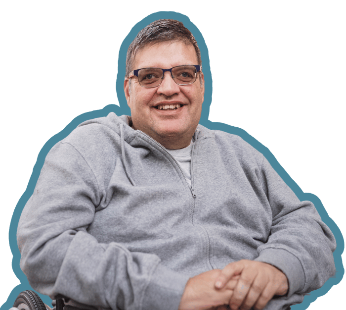 Happy disabled man smiling at camera
